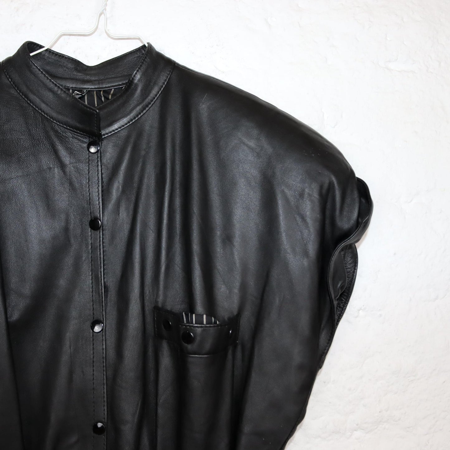 Vintage 80s 90s jumpsuit one-piece short sleeve shoulder pads leather black short button placket fitted 36