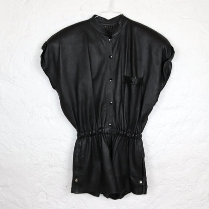 Vintage 80s 90s jumpsuit one-piece short sleeve shoulder pads leather black short button placket fitted 36