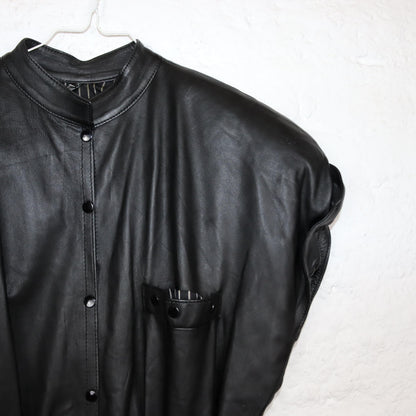 Vintage 80s 90s jumpsuit one-piece short sleeve shoulder pads leather black short button placket fitted 36