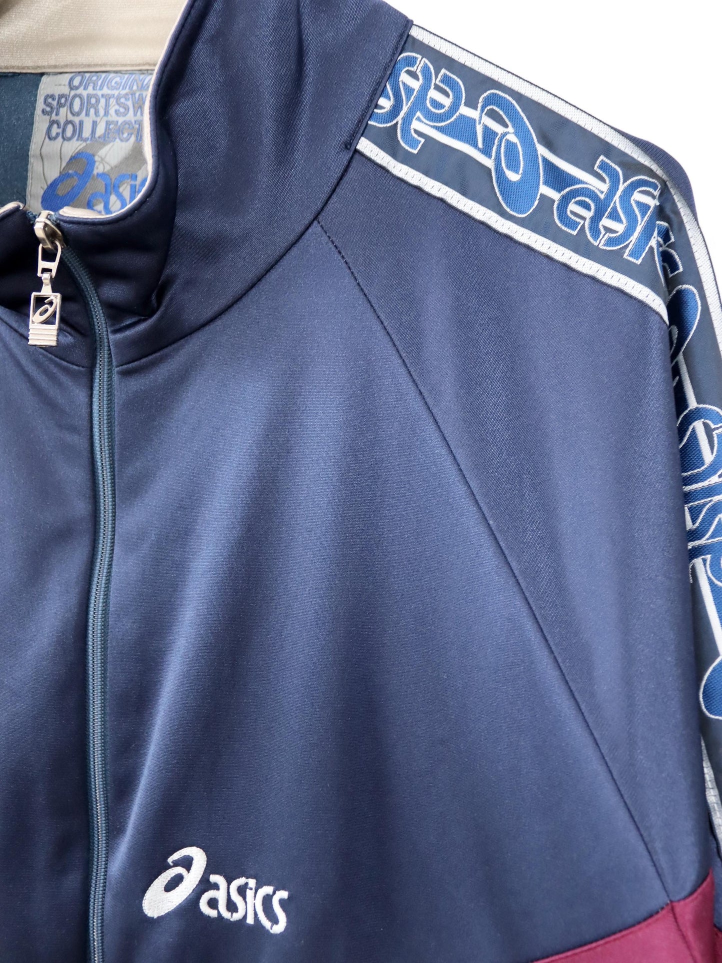 Vintage 80er 90er ASICS Trainingsjacke Jacke Stehkragen dunkelblau beige rot 58 3XL